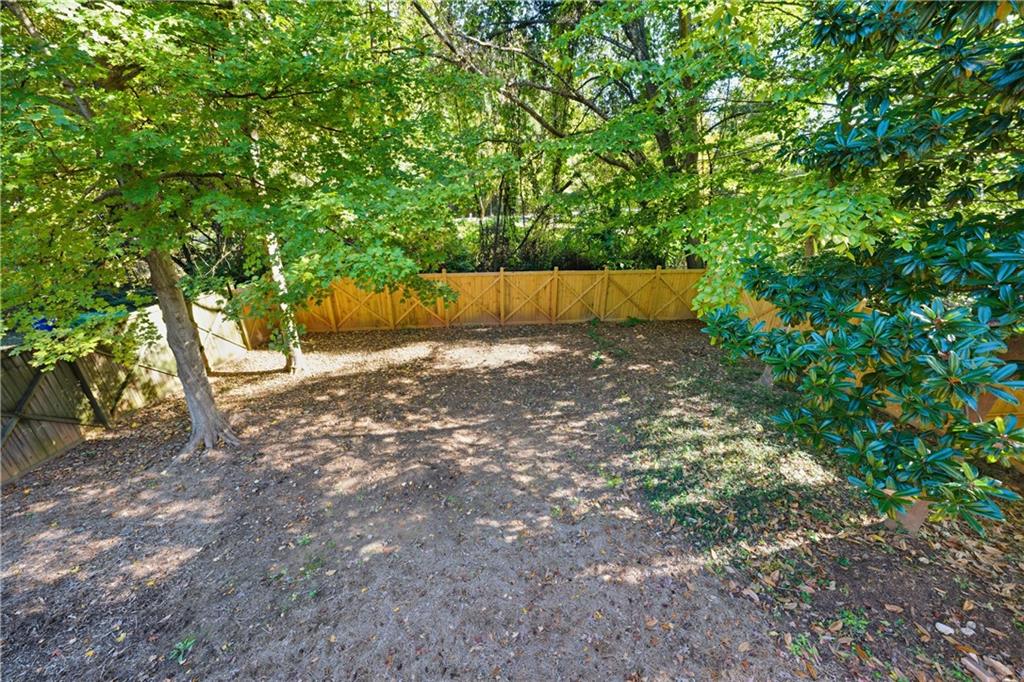 1295 Cumberland Road Northeast Atlanta, GA 30306 - Photo 60 of 71 a view of a yard with a tree