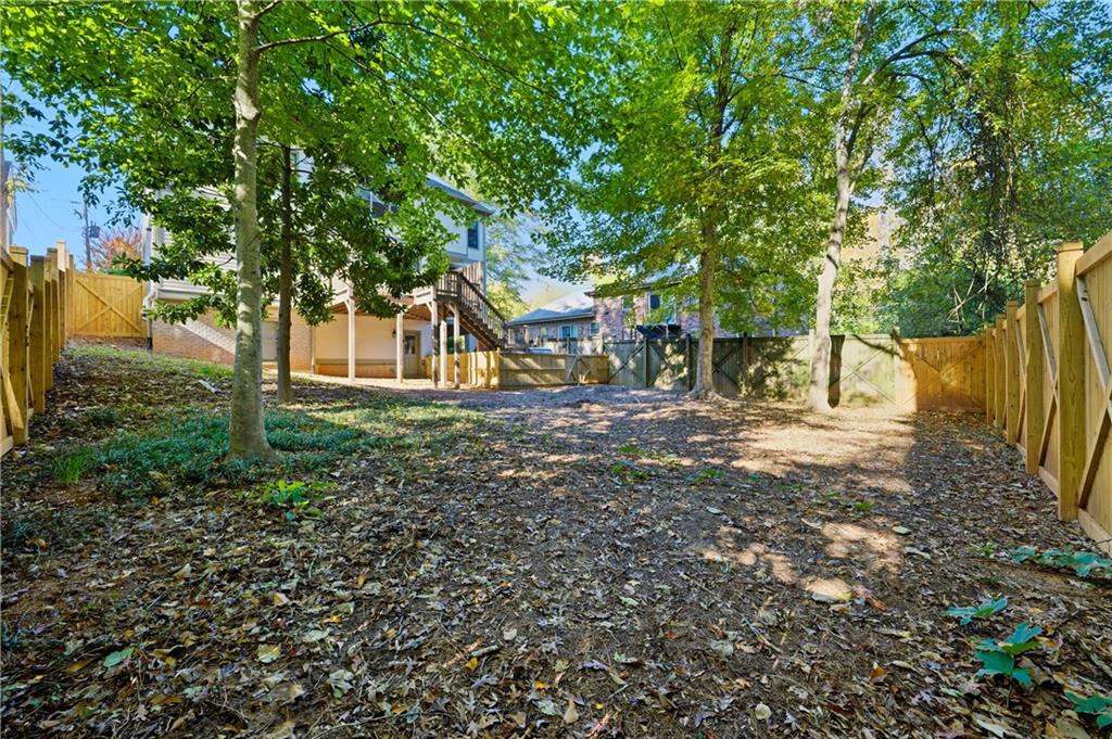 1295 Cumberland Road Northeast Atlanta, GA 30306 - Photo 66 of 71 a backyard of a house with lots of green space