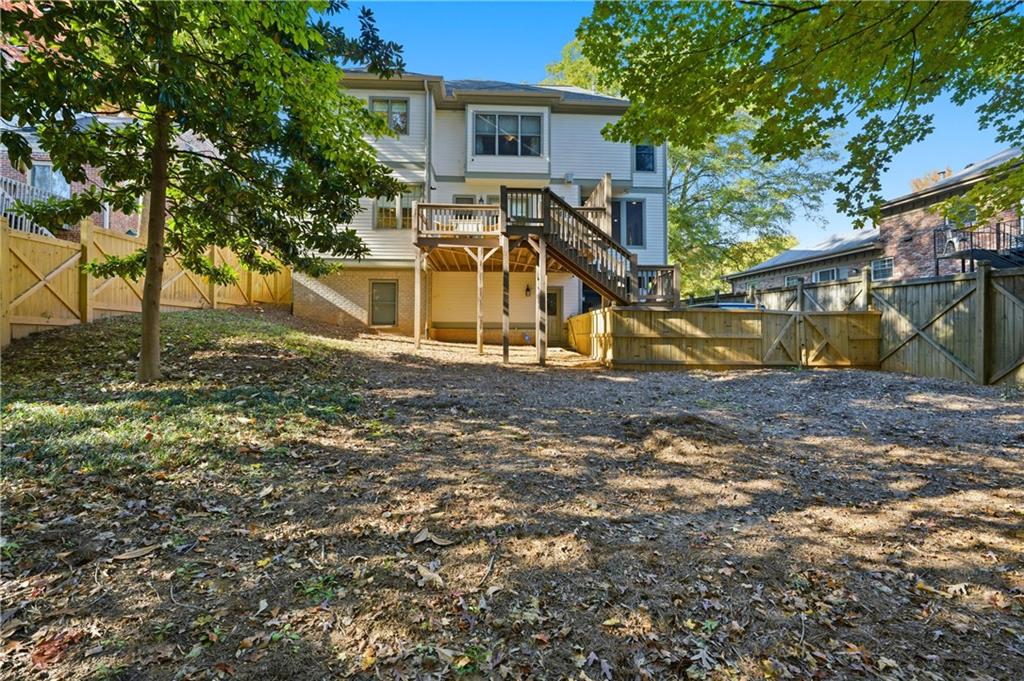 1295 Cumberland Road Northeast Atlanta, GA 30306 - Photo 67 of 71 a view of a house with a yard