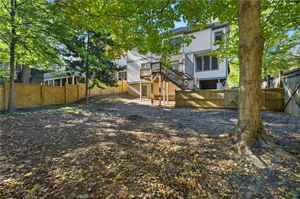 1295 Cumberland Road Northeast Atlanta, GA 30306 - Photo 69 of 71 a view of a house with a yard