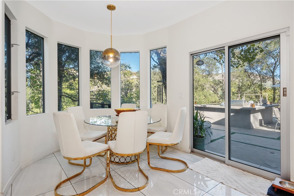 22 Round Up Road Bell Canyon, CA 91307 - Photo 14 of 39 a living room with furniture and a floor to ceiling window