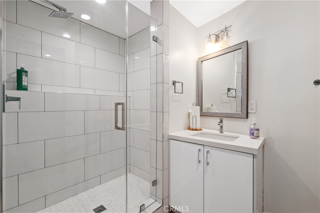 22 Round Up Road Bell Canyon, CA 91307 - Photo 30 of 39 a bathroom with a sink shower and a mirror