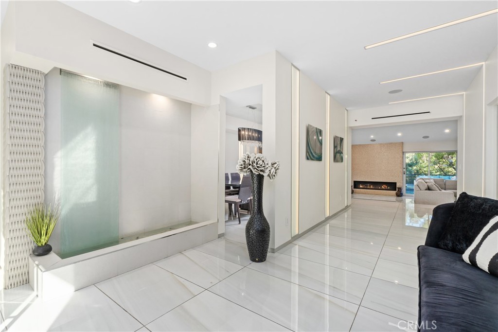 22 Round Up Road Bell Canyon, CA 91307 - Photo 3 of 39 a living room with furniture and a chandelier
