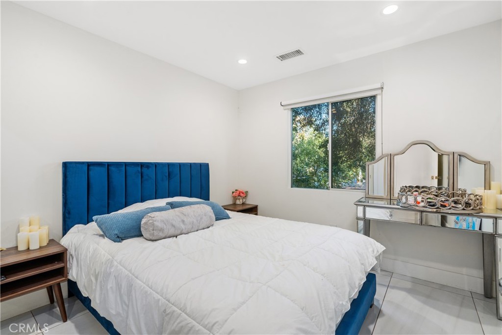 22 Round Up Road Bell Canyon, CA 91307 - Photo 31 of 39 a bedroom with a bed and a table