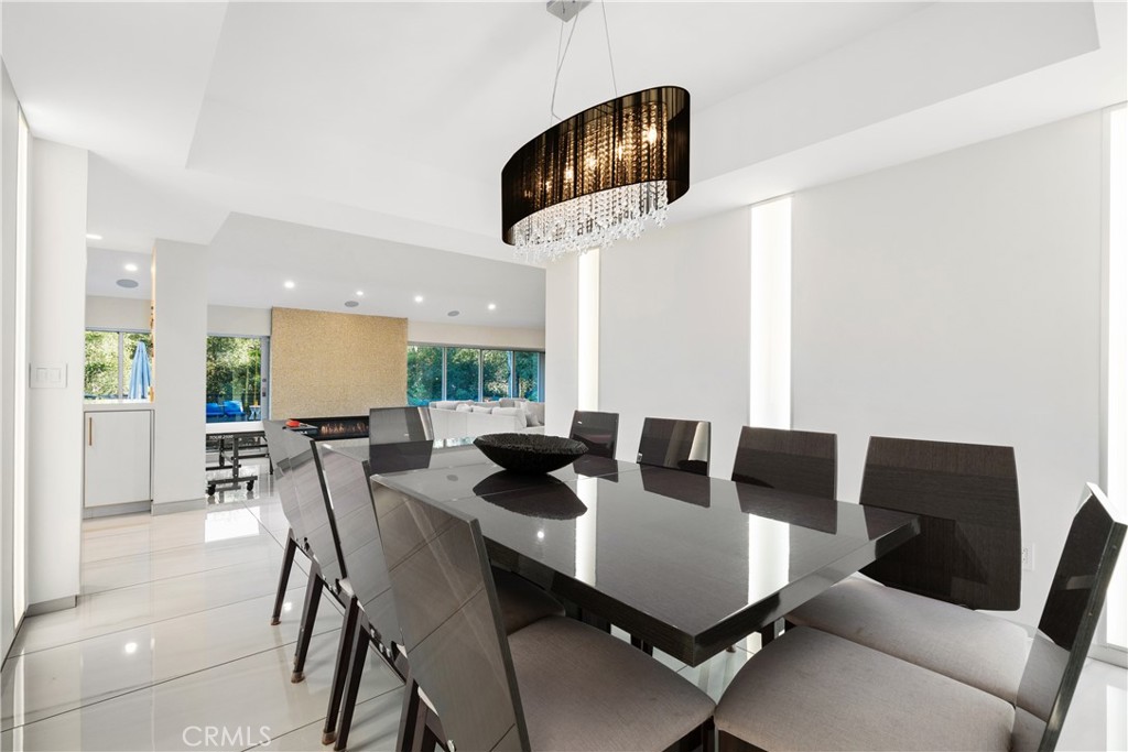22 Round Up Road Bell Canyon, CA 91307 - Photo 4 of 39 a view of a dining room with furniture and a potted plant