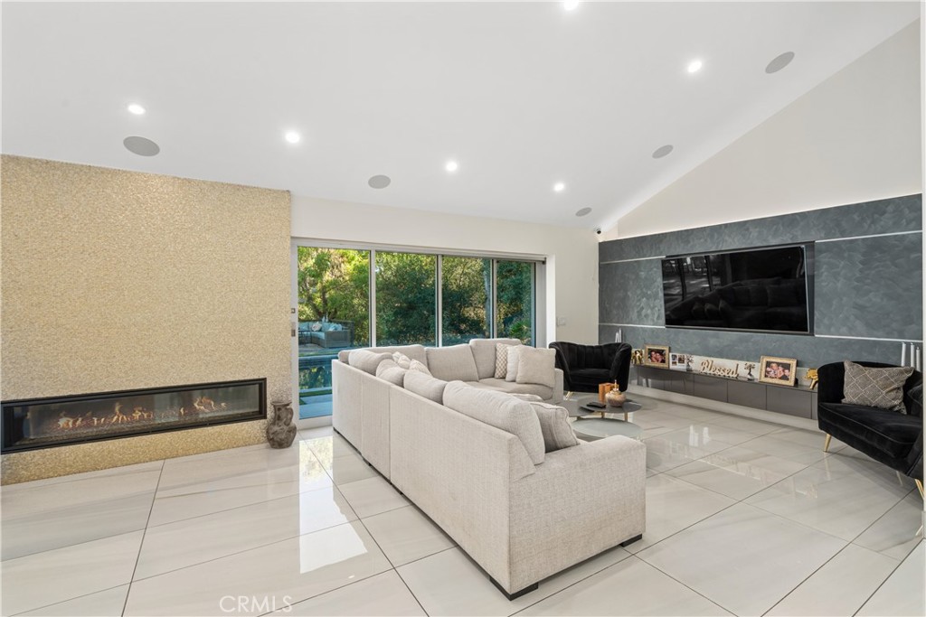 22 Round Up Road Bell Canyon, CA 91307 - Photo 6 of 39 a living room with furniture and a flat screen tv