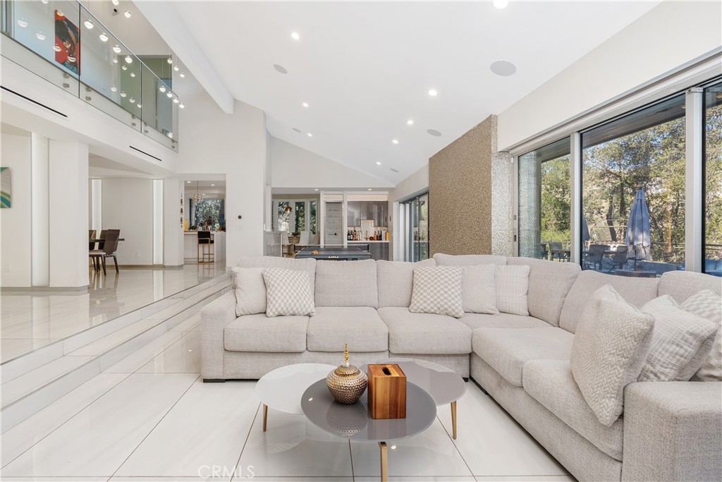 22 Round Up Road Bell Canyon, CA 91307 - Photo 7 of 39 a living room with furniture and a large window