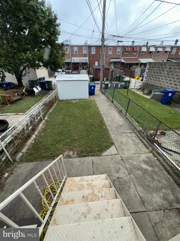 a view of a yard with an outdoor seating