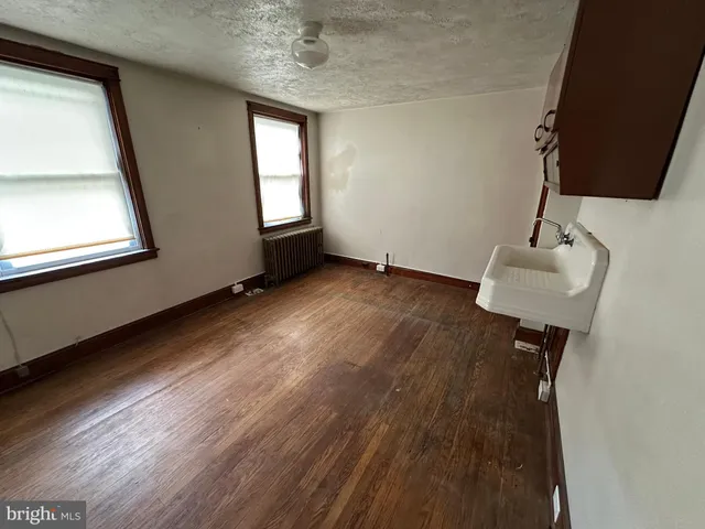 a bathroom with a toilet a sink and a shower
