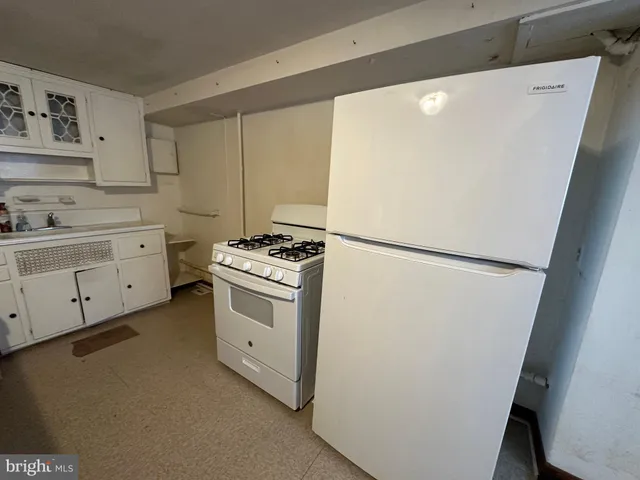 a room with lots of furniture and windows