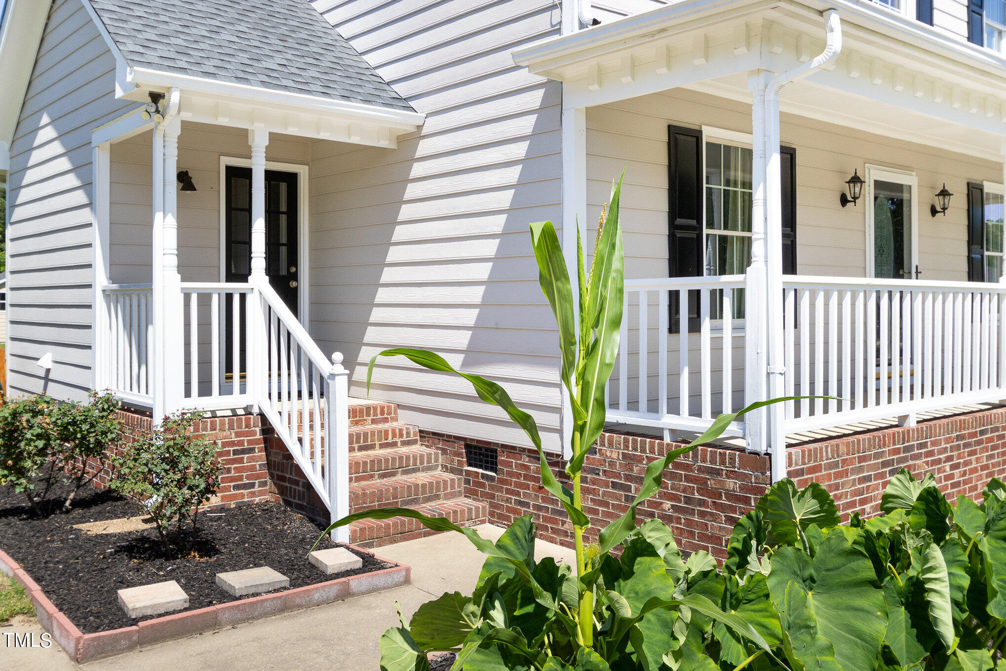 6004 Swales Way Raleigh, NC 27603 - Photo 17 of 24 a view of a house with porch and wooden floor