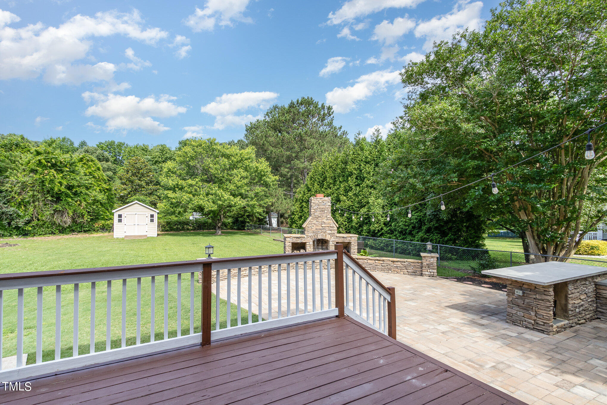 6004 Swales Way Raleigh, NC 27603 - Photo 19 of 24 a view of a wooden deck and a yard