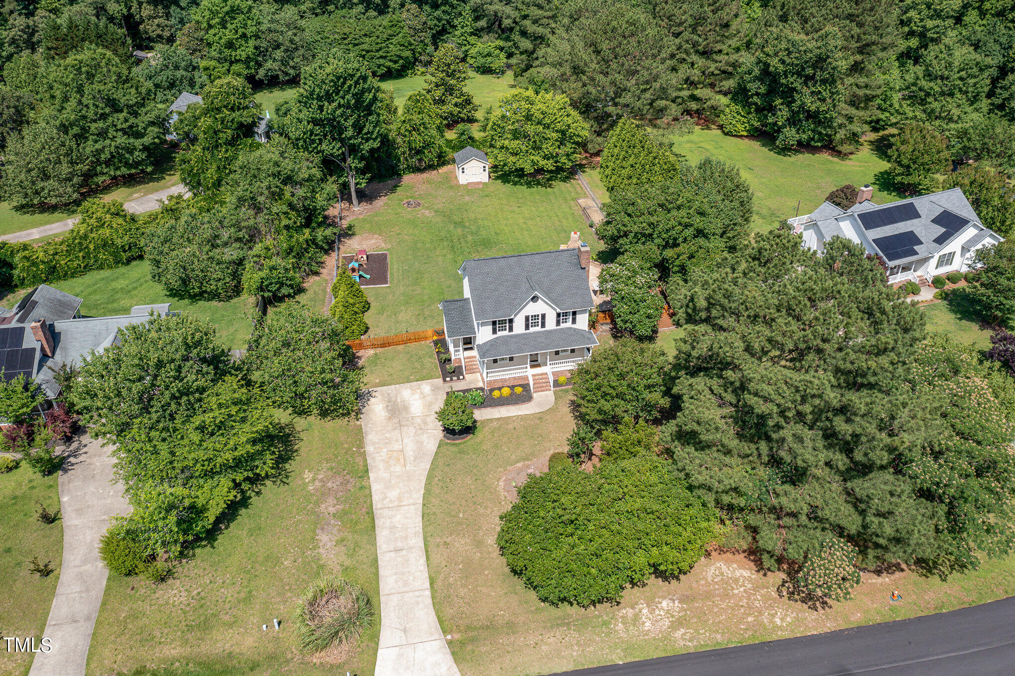 6004 Swales Way Raleigh, NC 27603 - Photo 2 of 24 an aerial view of a house with a yard lake and trees all around