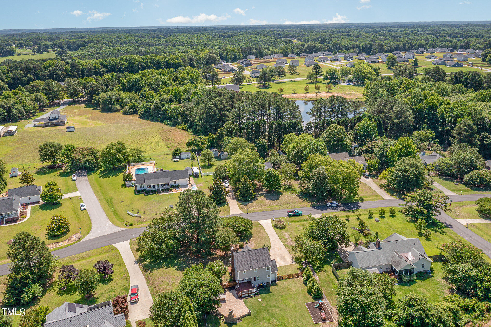 6004 Swales Way Raleigh, NC 27603 - Photo 24 of 24 an aerial view of residential houses with outdoor space and river