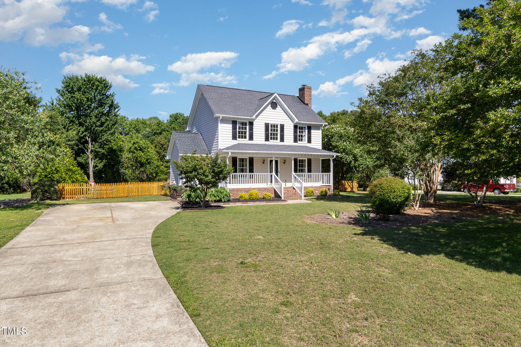 6004 Swales Way Raleigh, NC 27603 - Photo 3 of 24 a front view of a house with yard and green space