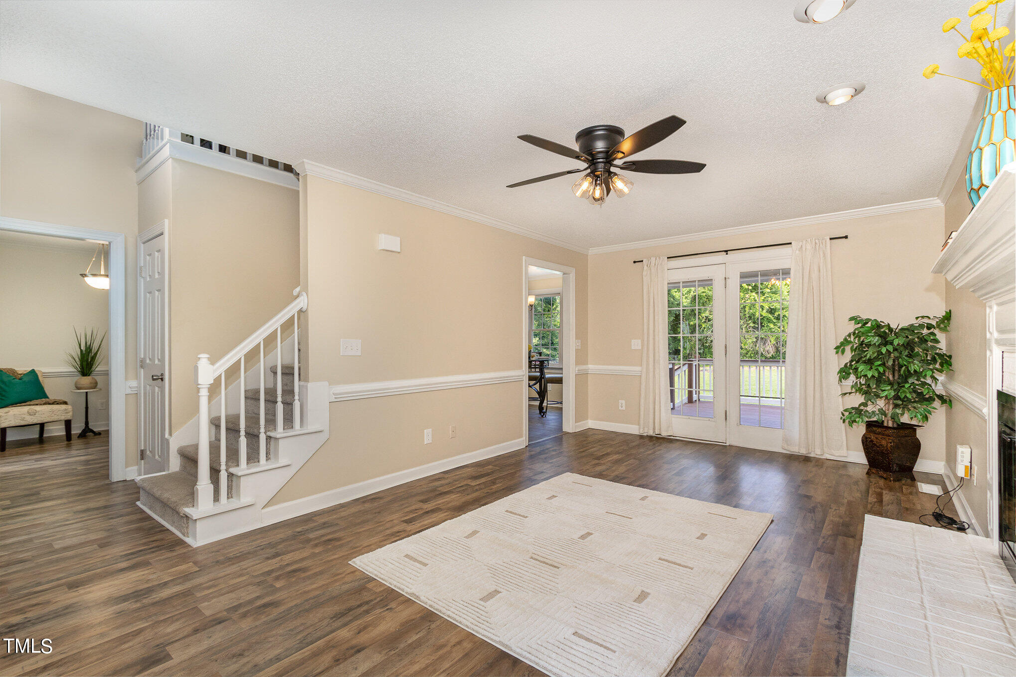 6004 Swales Way Raleigh, NC 27603 - Photo 5 of 24 a view of a hallway with wooden floor and a potted plant