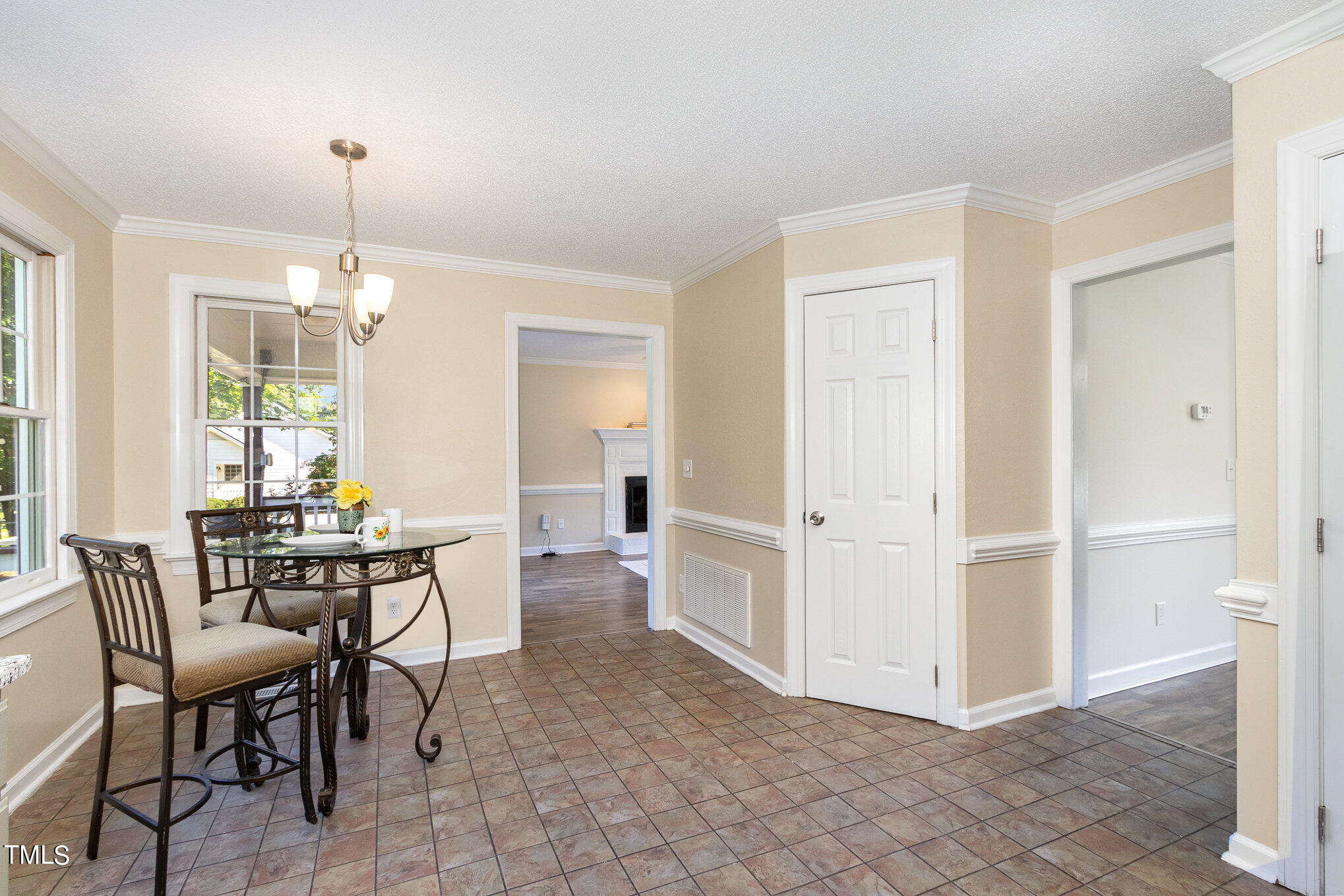 6004 Swales Way Raleigh, NC 27603 - Photo 9 of 24 a view of a dining room with furniture window and outside view