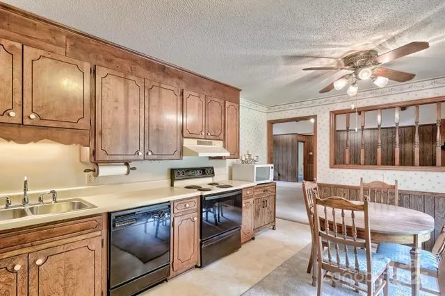 a kitchen sink with a granite countertop sink
