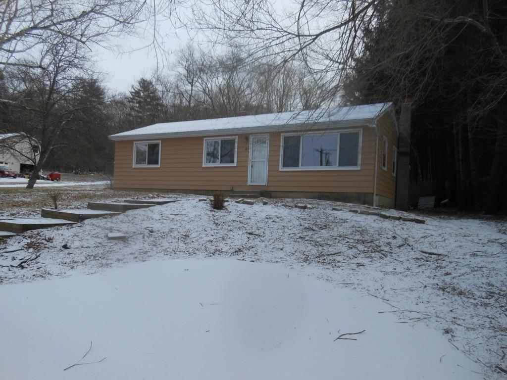 25 Hampton Road Chaplin, CT 06235 - Photo 1 of 1 a front view of a house with a yard