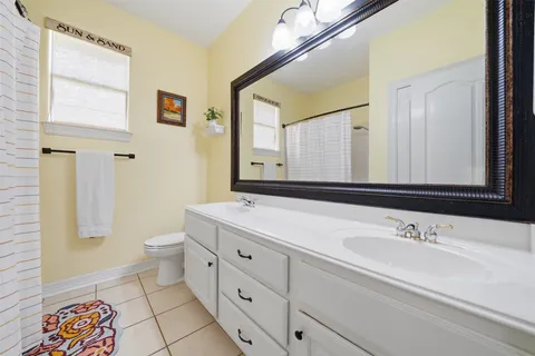 a view of a kitchen with sink and wooden floor