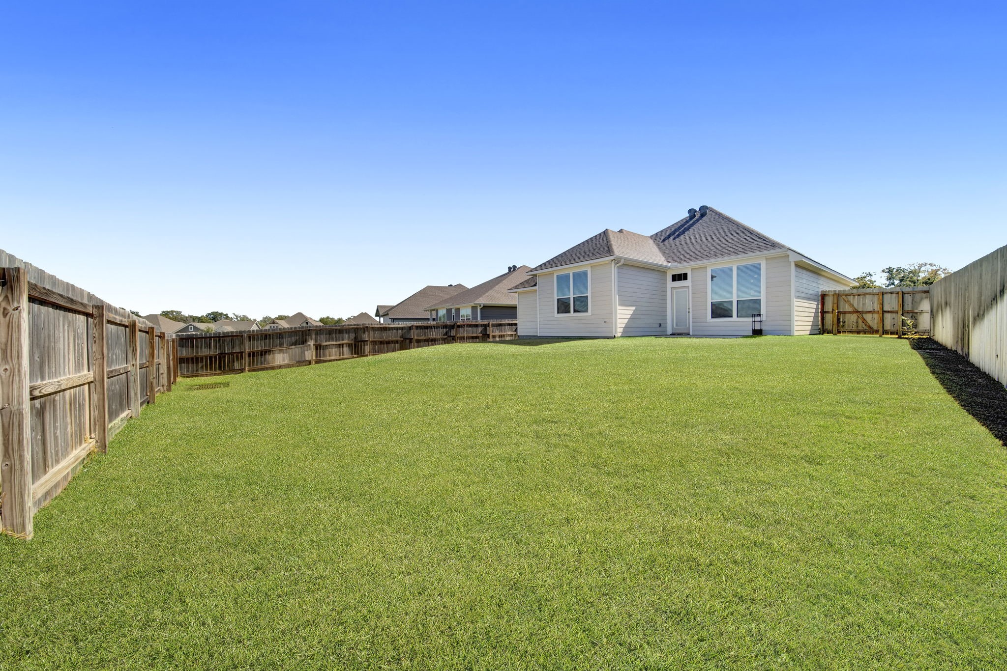 4791 Native Tree Lane Bryan, TX 77845 - Photo 17 of 22 a view of a house with a yard