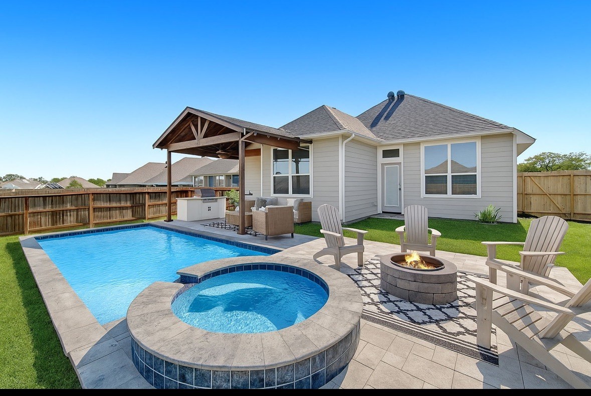 4791 Native Tree Lane Bryan, TX 77845 - Photo 18 of 22 a view of a house with swimming pool and sitting area