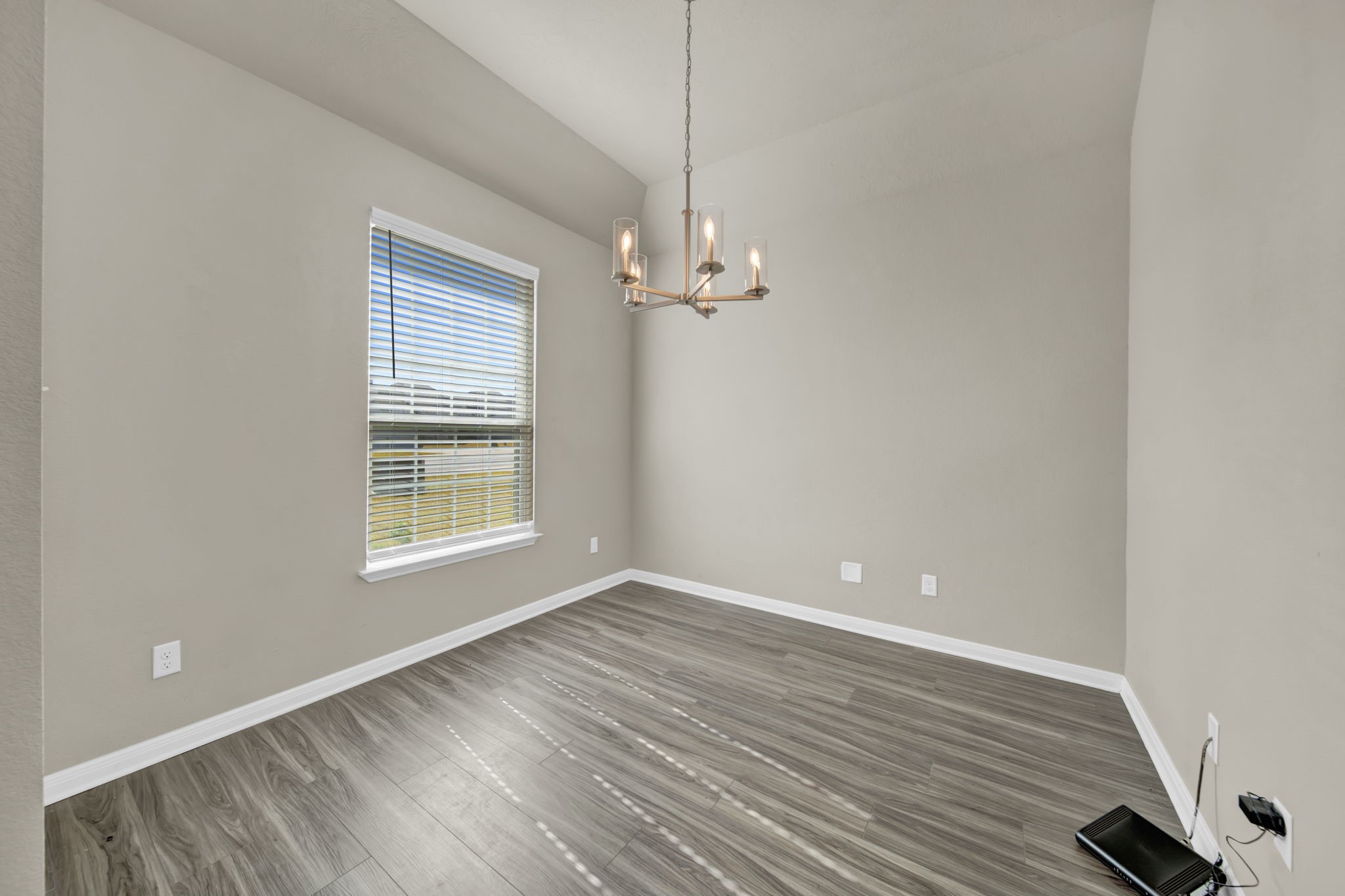 4791 Native Tree Lane Bryan, TX 77845 - Photo 5 of 22 wooden floor in an empty room with a window