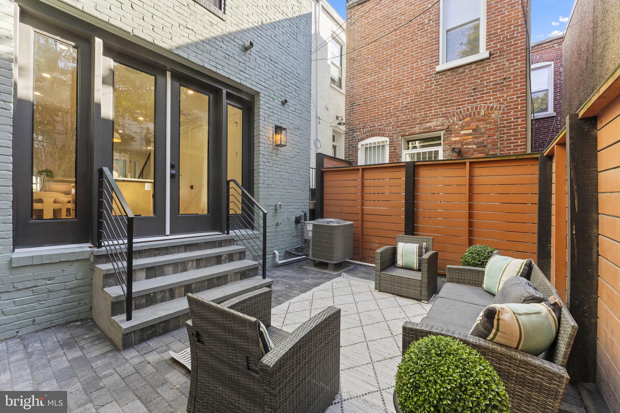 602 U Street Northwest Washington, DC 20001 - Photo 12 of 39 a view of outdoor living space with furniture and floor to ceiling window