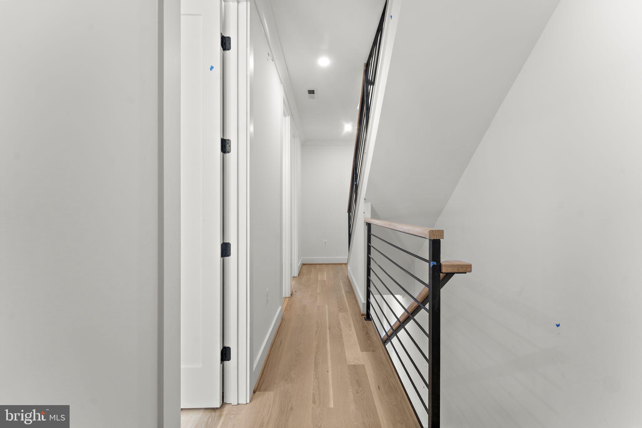 602 U Street Northwest Washington, DC 20001 - Photo 14 of 39 a view of a hallway with wooden floor and staircase