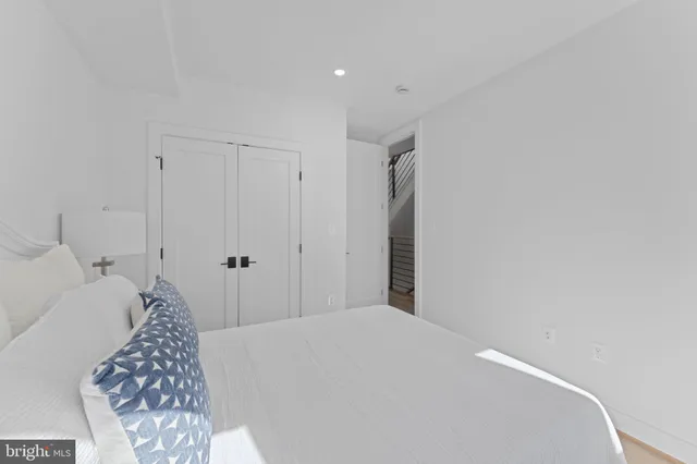 a bedroom with a bed and a cabinets