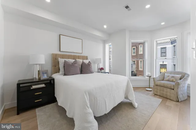 a bedroom with a bed and a couch