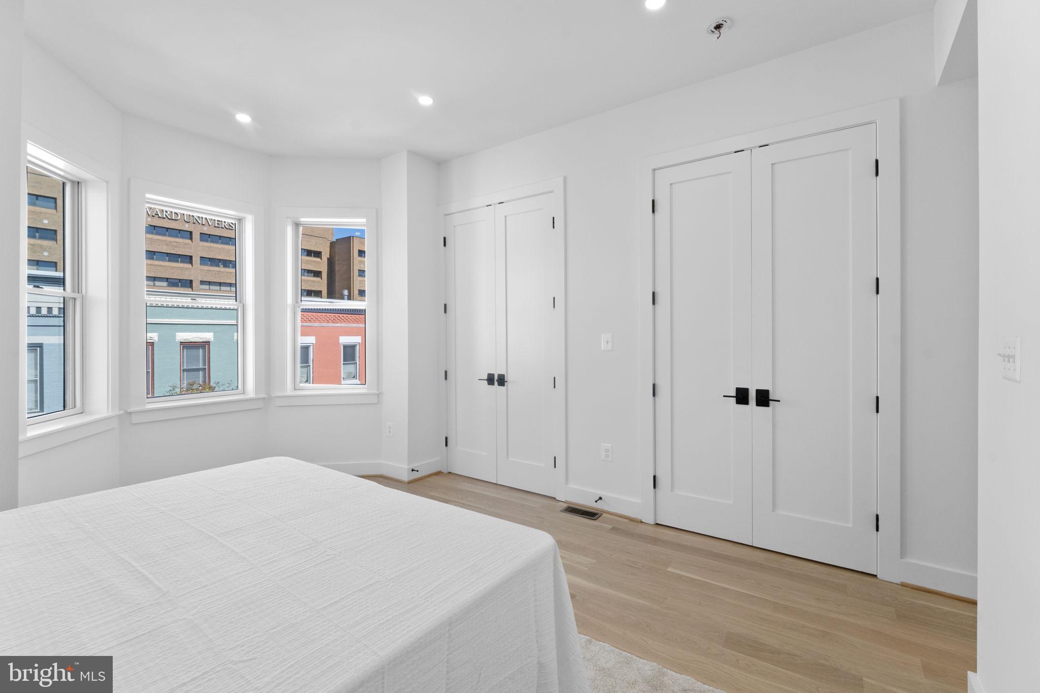 602 U Street Northwest Washington, DC 20001 - Photo 30 of 39 a bedroom with a bed and a window