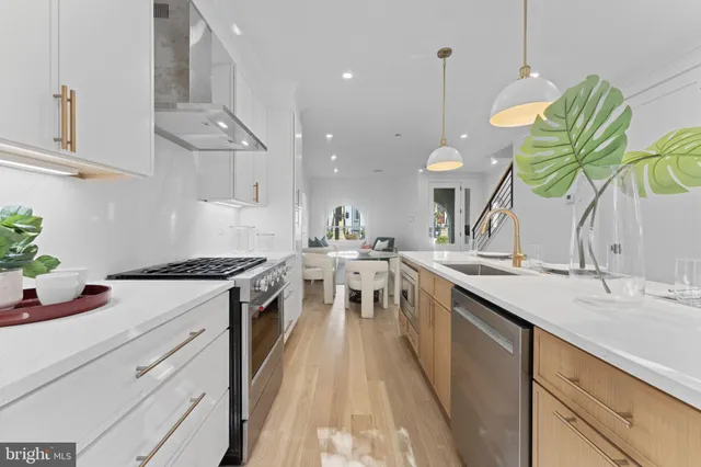 a kitchen with a stove and a sink