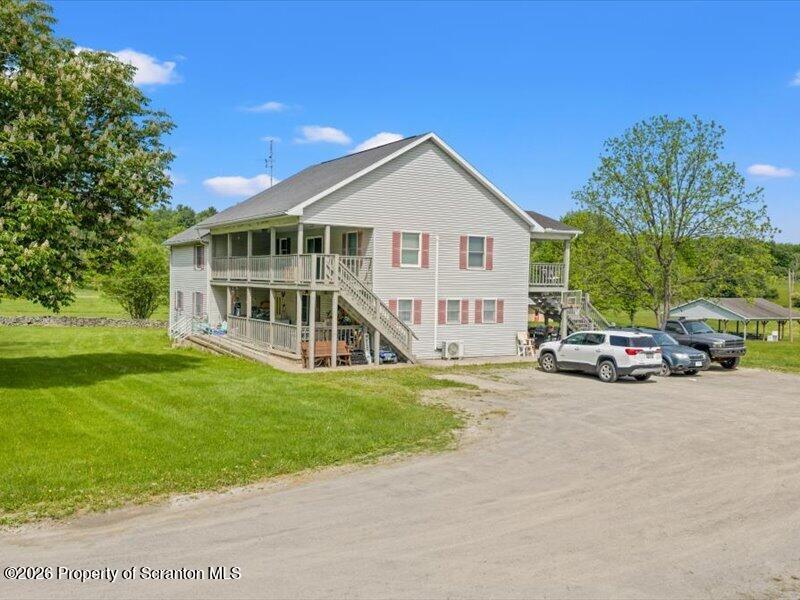 9-17 Vago Road Tunkhannock, PA 18657 - Photo 2 of 57 a view of a house with a big yard and large trees