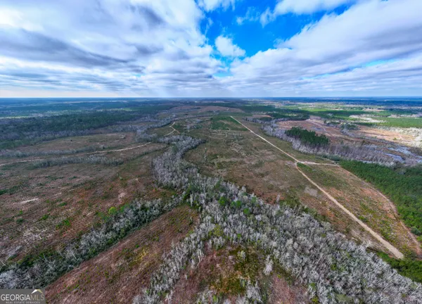 a view of a yard with an ocean