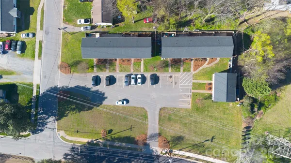 an aerial view of a house with a swimming pool
