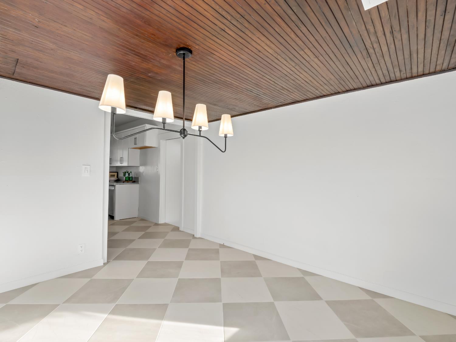 425 West Elm Street Hanford, CA 93230 - Photo 9 of 18 a view of a hallway with a kitchen