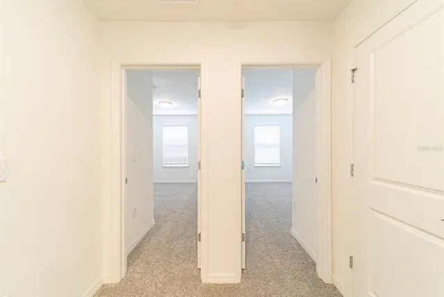 a view of a bathroom from a hallway