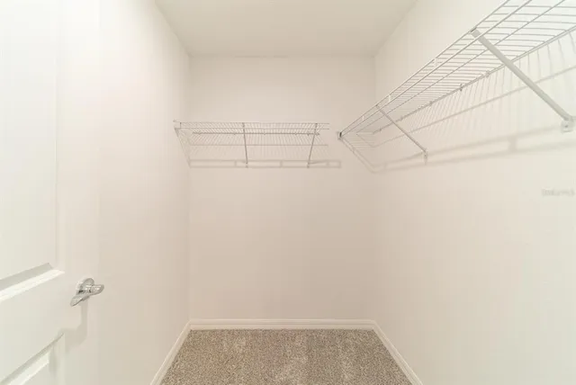 a view of a room with racks on the wall