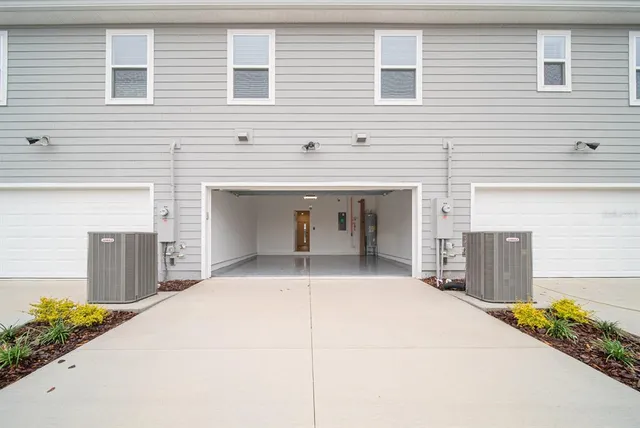 a view of swimming pool with outdoor seating and plants
