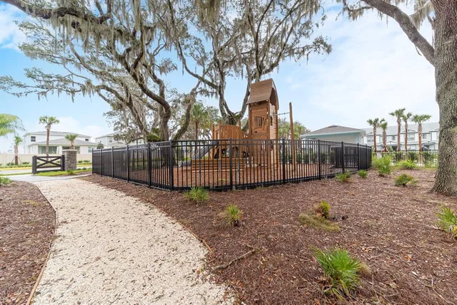 a view of a backyard with a garden and plants