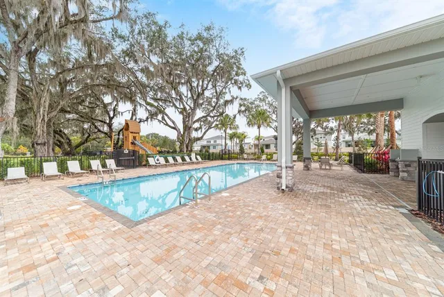 a view of a park with iron fence