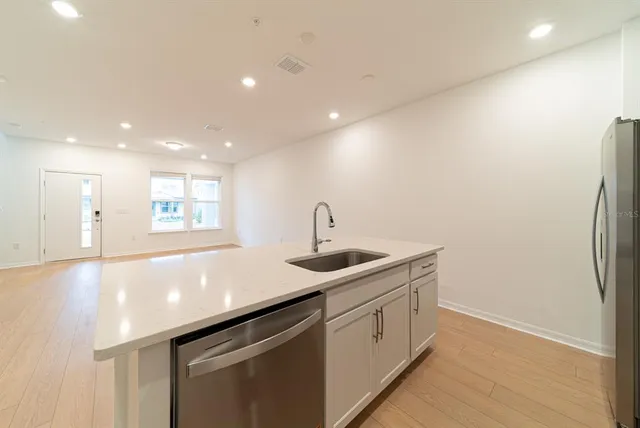 a kitchen with a sink and cabinets