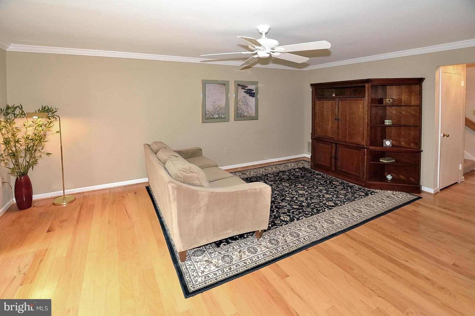 1769 Ivy Oak Square Reston, VA 20190 - Photo 12 of 24 a living room with hard wood flooring and a couch