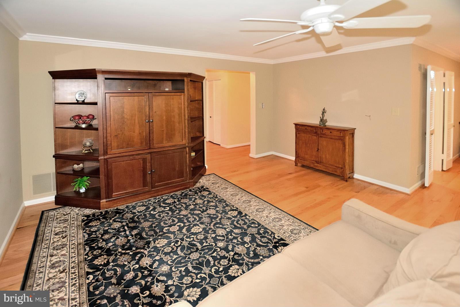 1769 Ivy Oak Square Reston, VA 20190 - Photo 13 of 24 a bedroom with a bed and a dresser