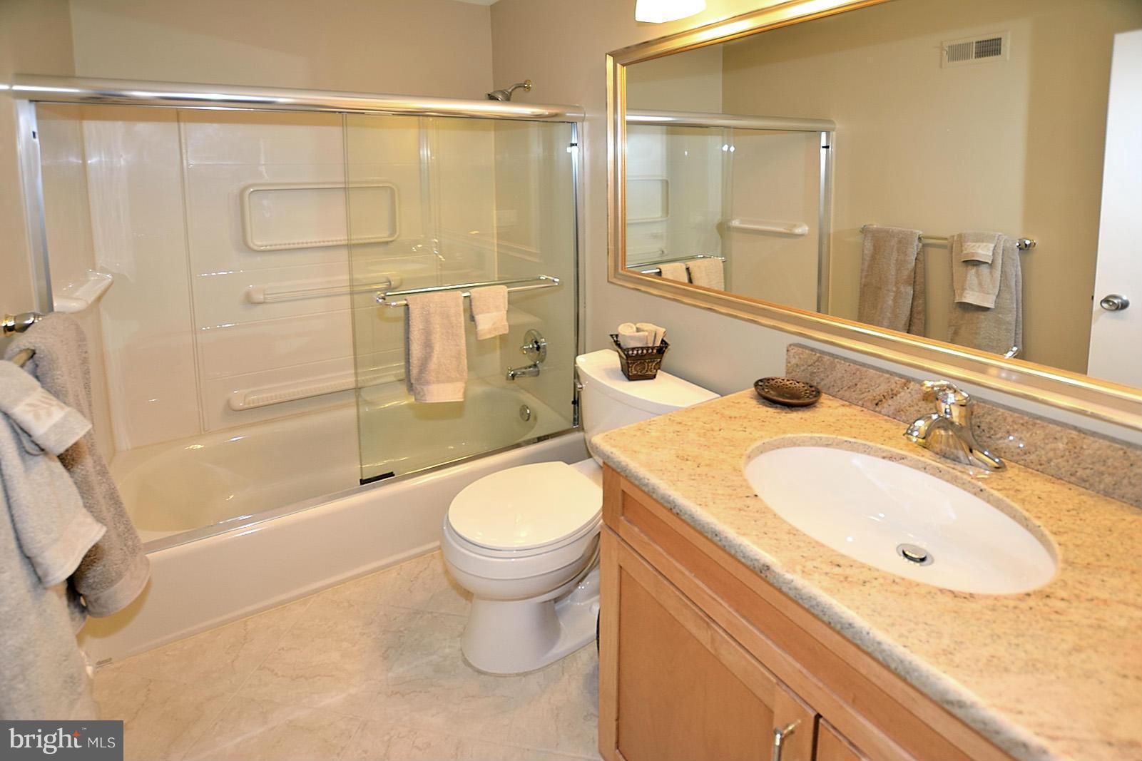 1769 Ivy Oak Square Reston, VA 20190 - Photo 19 of 24 a bathroom with a sink toilet and shower