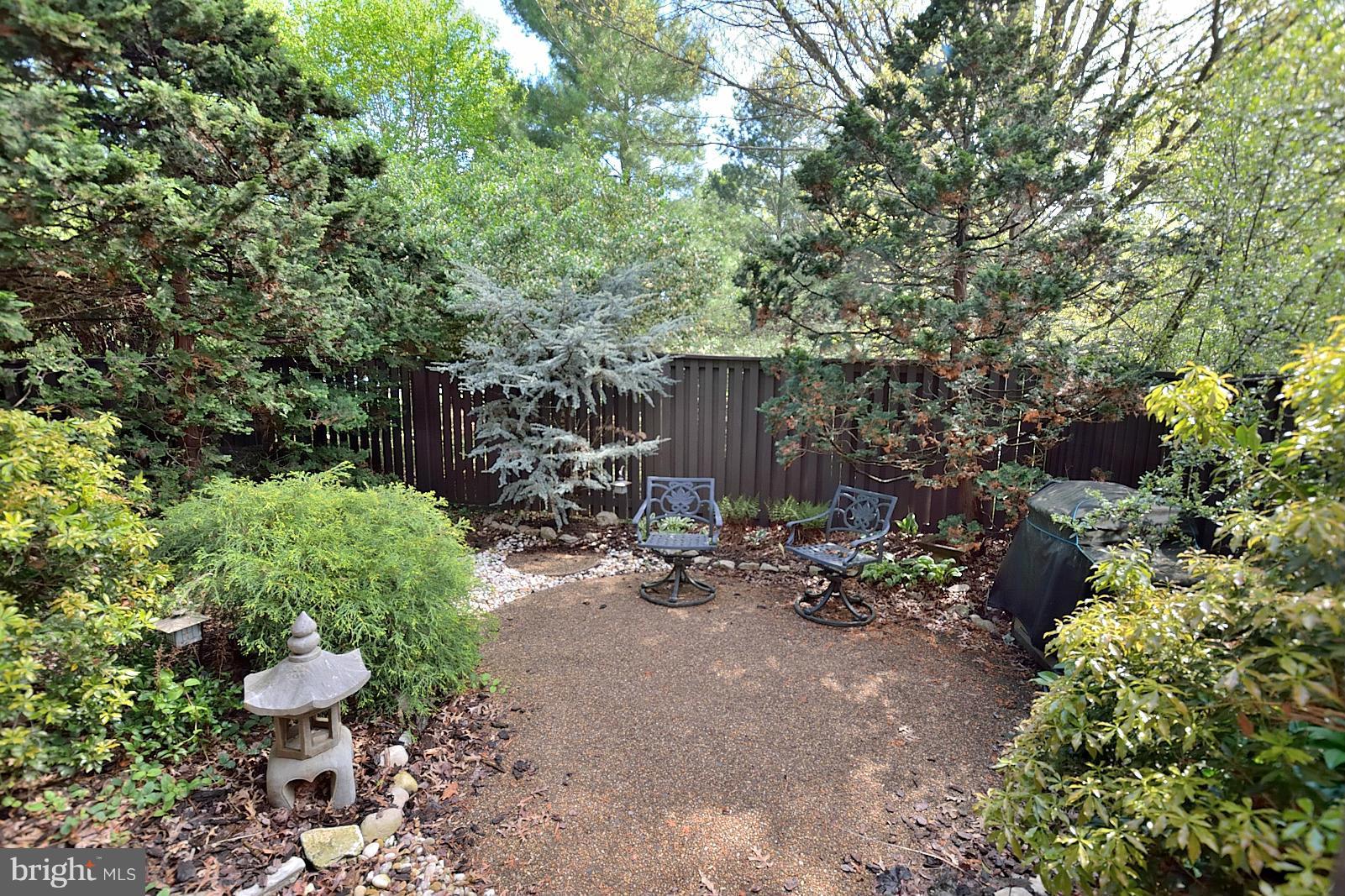 1769 Ivy Oak Square Reston, VA 20190 - Photo 23 of 24 a view of a patio with table and chairs and potted plants