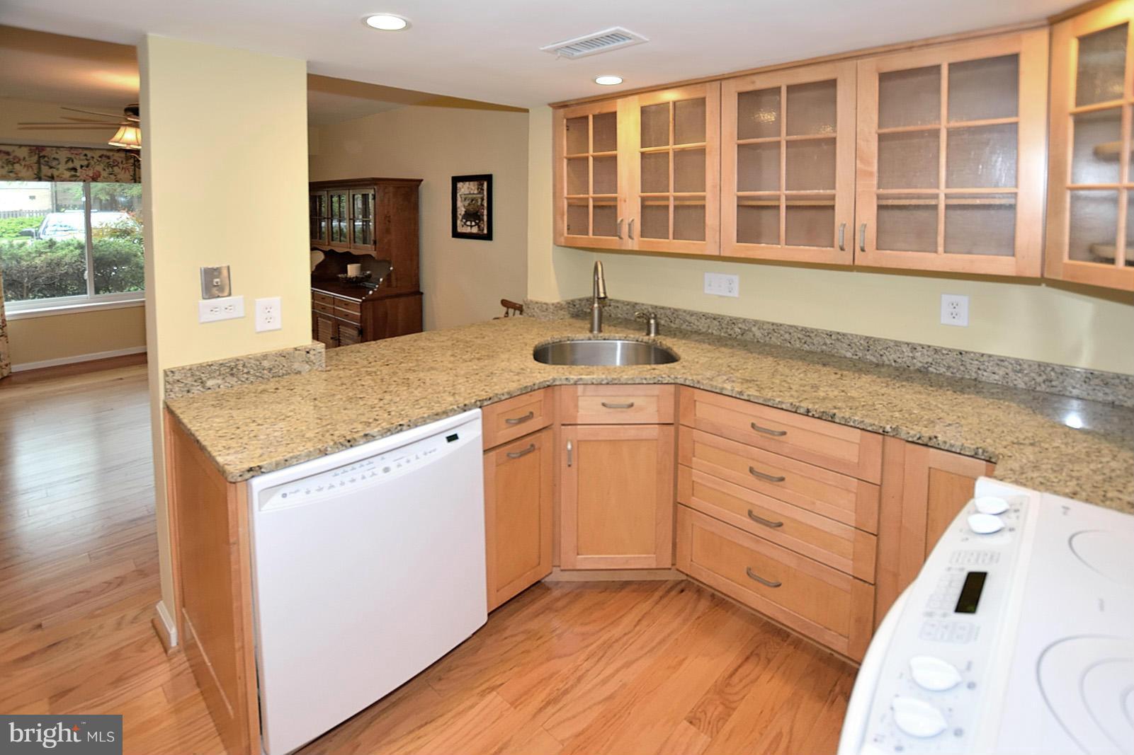1769 Ivy Oak Square Reston, VA 20190 - Photo 5 of 24 a kitchen with granite countertop cabinets and window