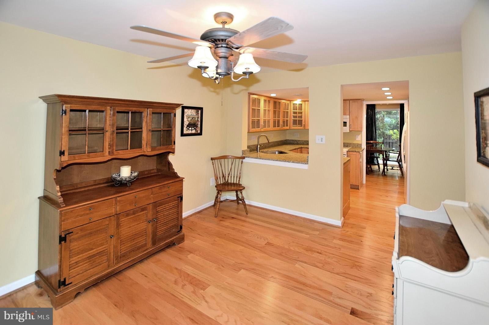 1769 Ivy Oak Square Reston, VA 20190 - Photo 6 of 24 a kitchen with stainless steel appliances granite countertop a stove and a wooden floors