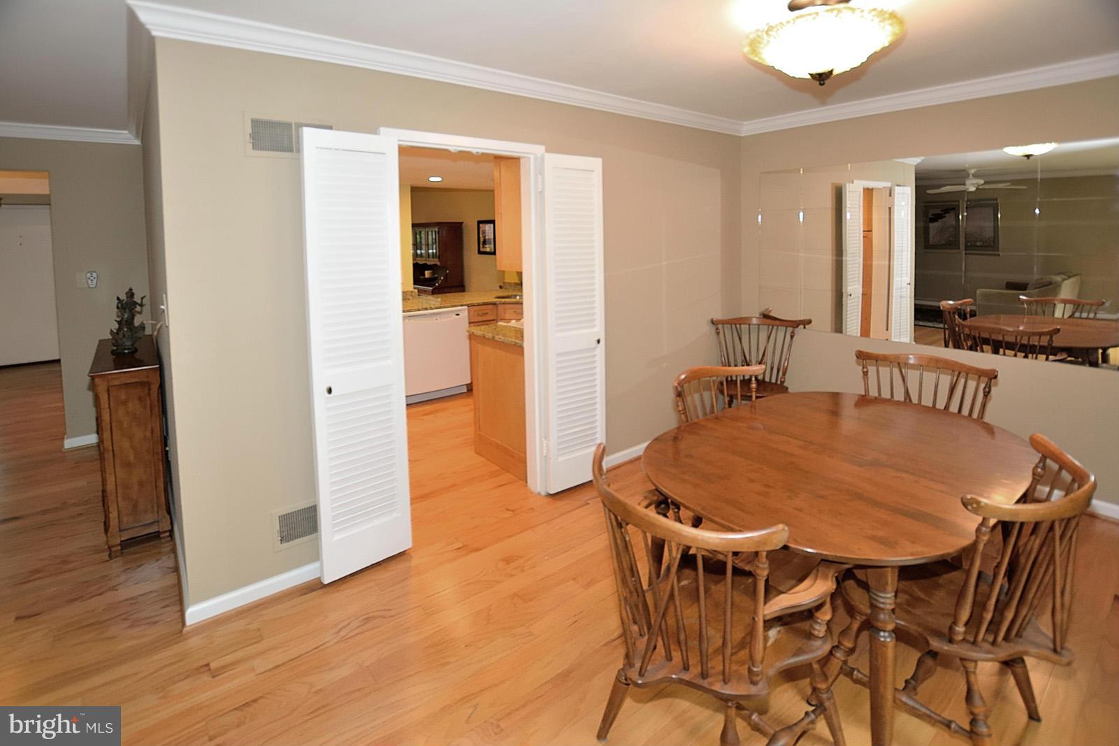 1769 Ivy Oak Square Reston, VA 20190 - Photo 8 of 24 a dining room with furniture and wooden floor